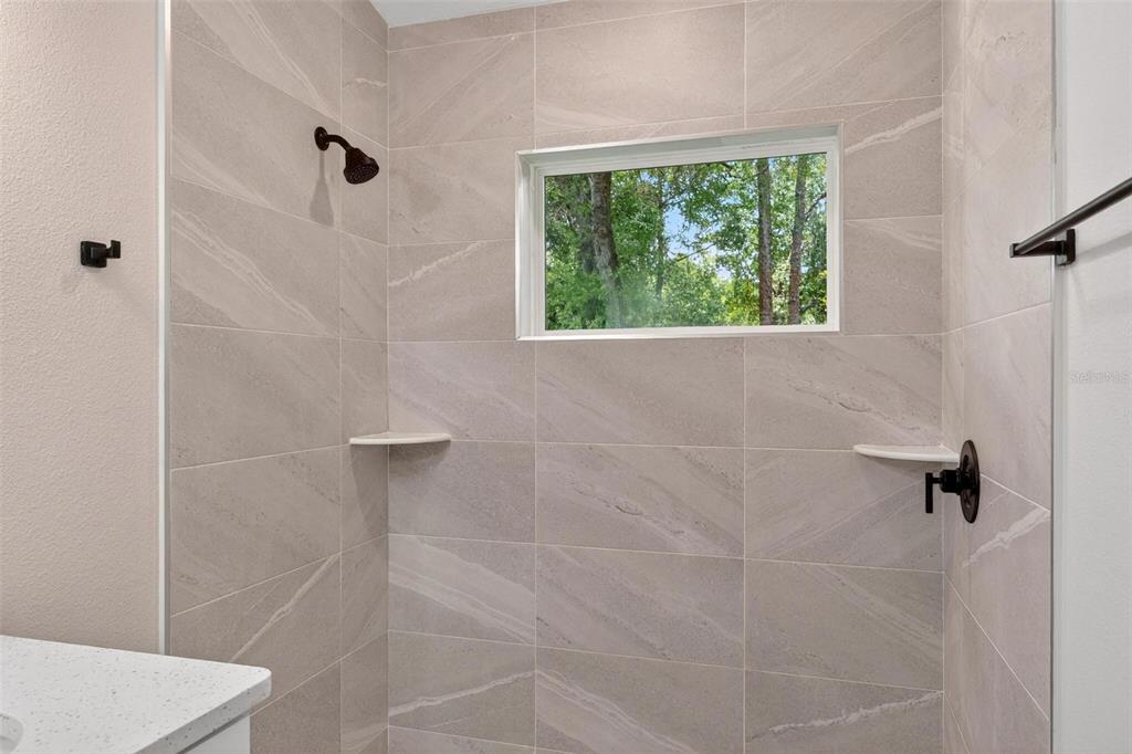 2132 Pine Meadows Golf Course Road Eustis, FL 32726 - Photo 26 of 62 a bathroom with a shower