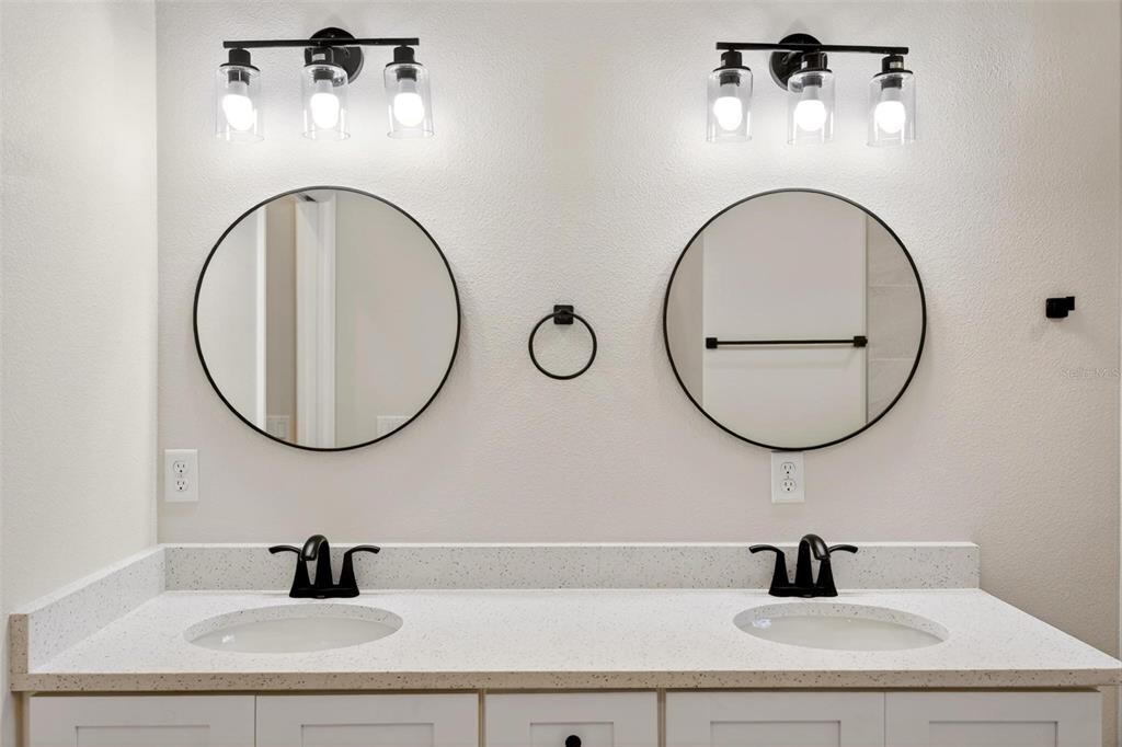 2132 Pine Meadows Golf Course Road Eustis, FL 32726 - Photo 29 of 62 a bathroom with a sink and a mirror