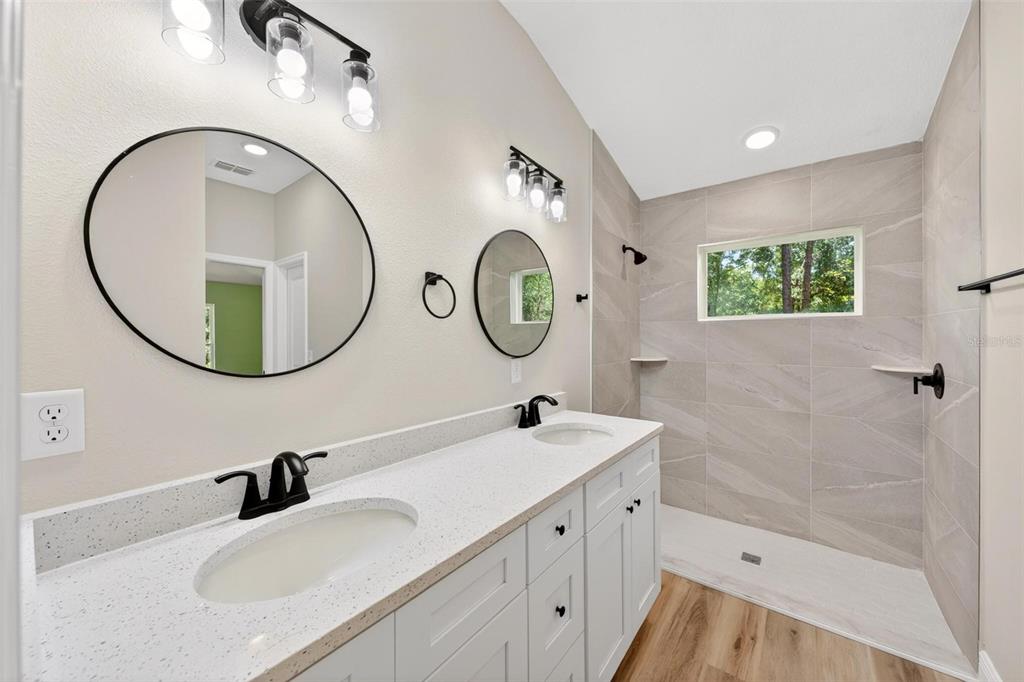 2132 Pine Meadows Golf Course Road Eustis, FL 32726 - Photo 30 of 62 a bathroom with a sink and a mirror