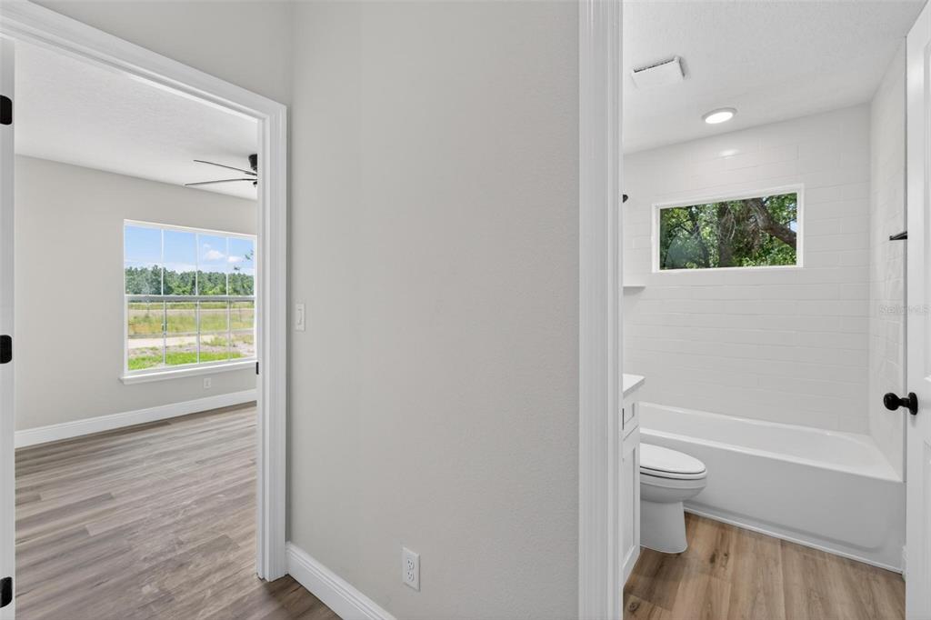 2132 Pine Meadows Golf Course Road Eustis, FL 32726 - Photo 36 of 62 a bathroom with a toilet and a shower