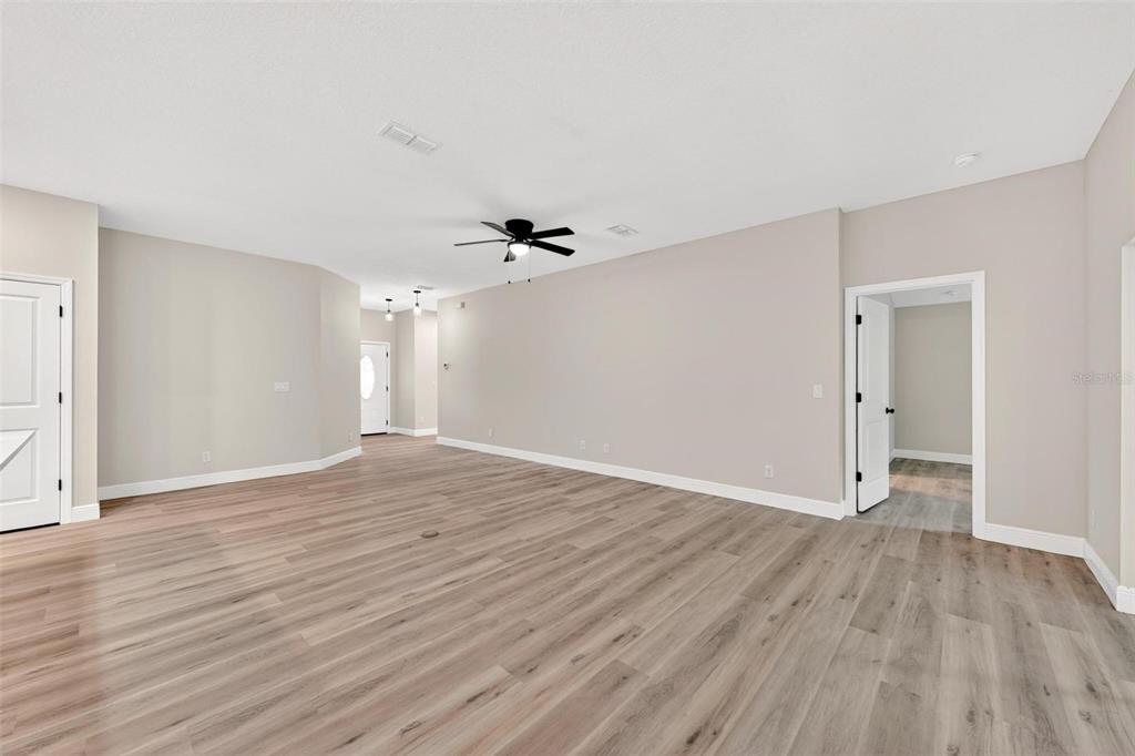 2132 Pine Meadows Golf Course Road Eustis, FL 32726 - Photo 4 of 62 a view of an empty room with wooden floor