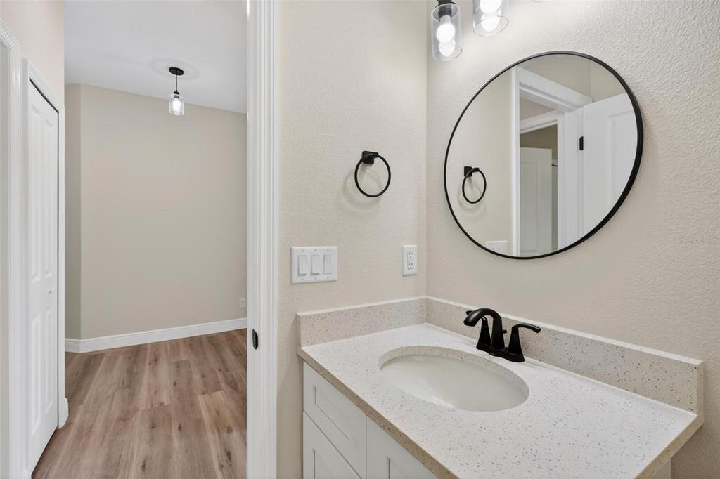 2132 Pine Meadows Golf Course Road Eustis, FL 32726 - Photo 41 of 62 a bathroom with a sink and a mirror