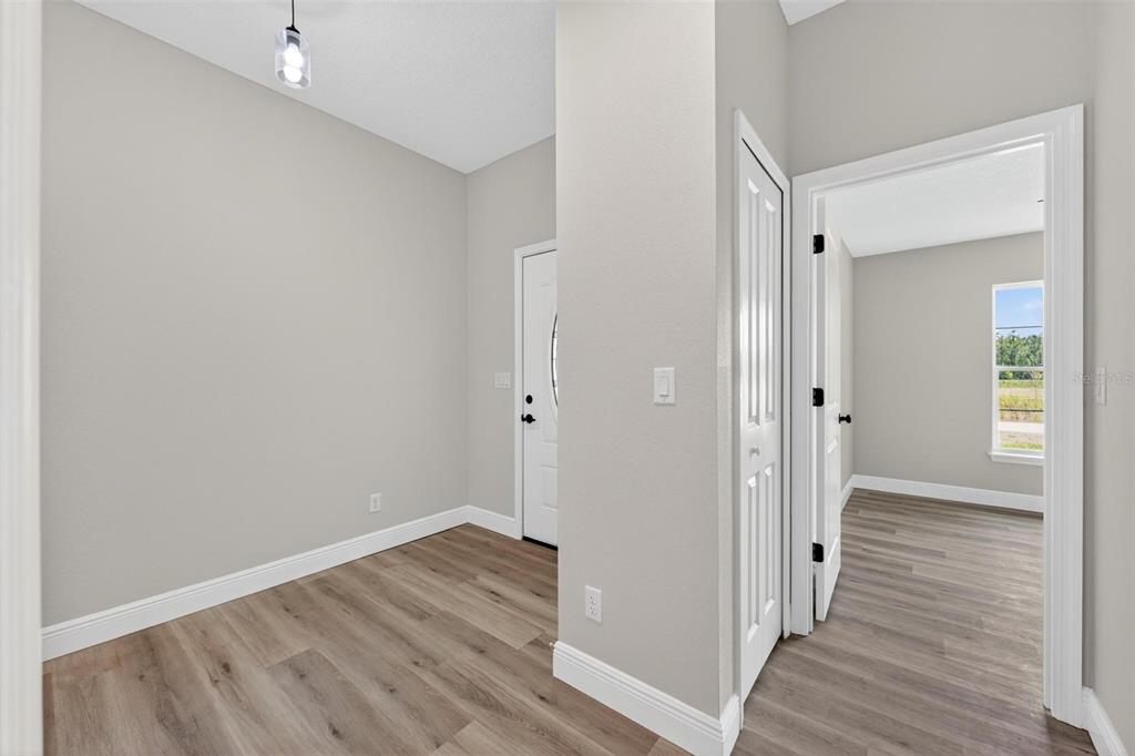 2132 Pine Meadows Golf Course Road Eustis, FL 32726 - Photo 45 of 62 a view of a hallway with wooden floor