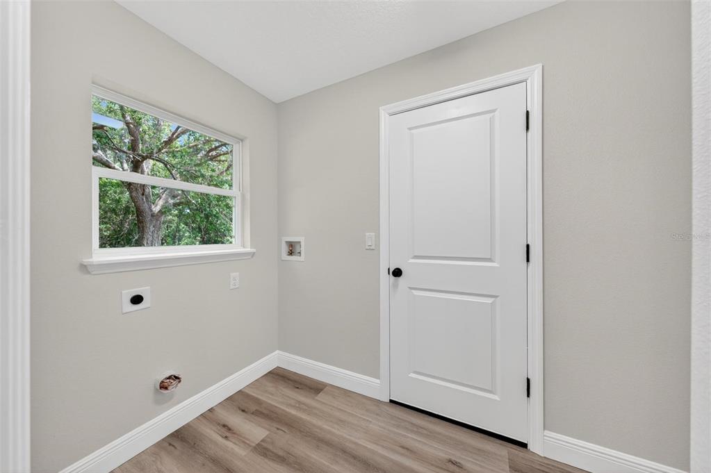 2132 Pine Meadows Golf Course Road Eustis, FL 32726 - Photo 47 of 62 a view of an empty room with wooden floor and window