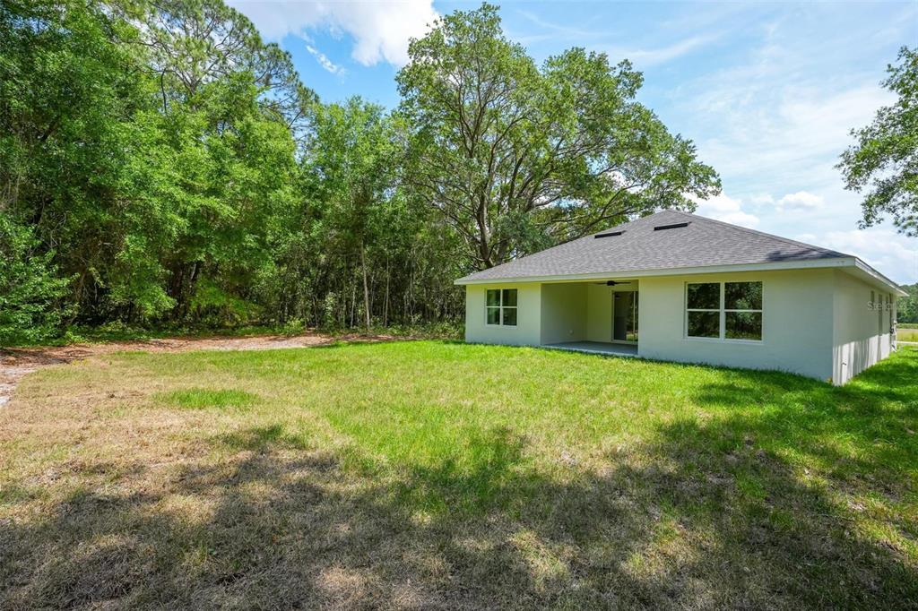 2132 Pine Meadows Golf Course Road Eustis, FL 32726 - Photo 61 of 62 a front view of a house with a garden