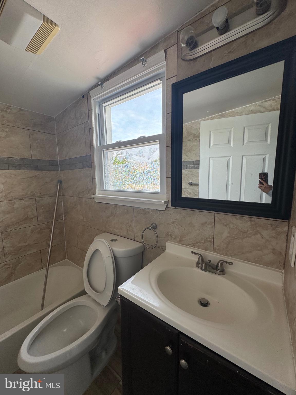 3706 Old York Road, Unit 2 Baltimore, MD 21218 - Photo 12 of 17 a bathroom with a sink and a mirror