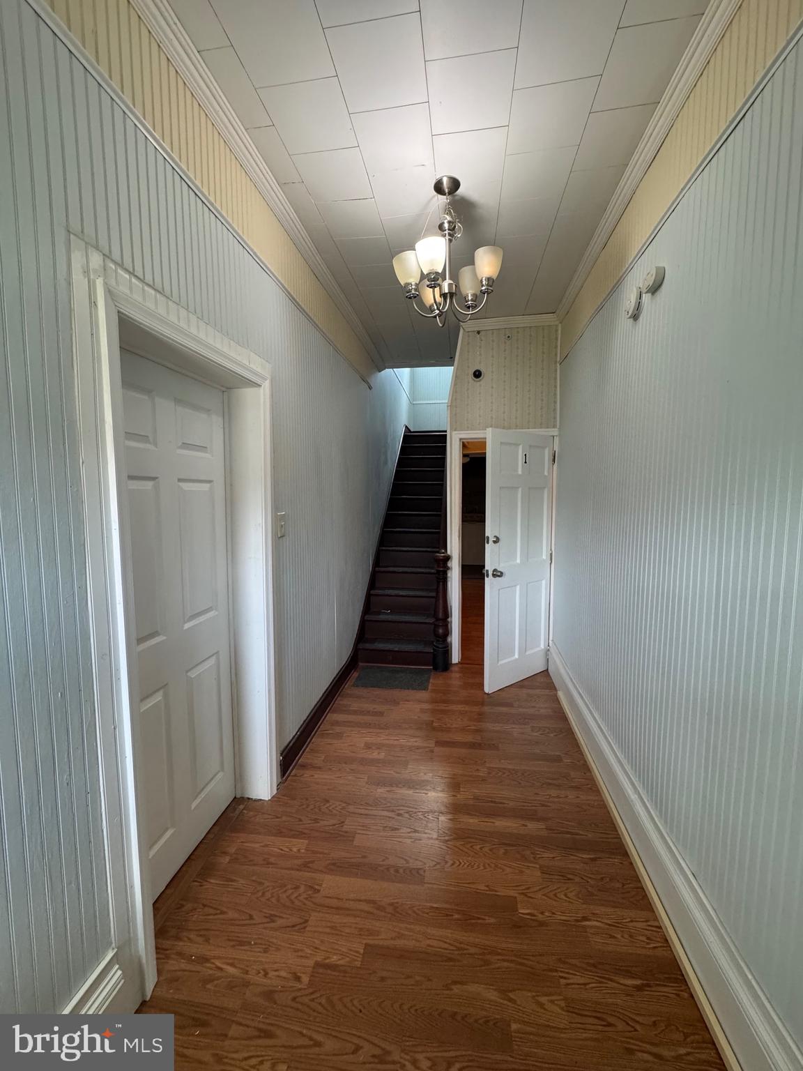3706 Old York Road, Unit 2 Baltimore, MD 21218 - Photo 3 of 17 en view of a hallway with wooden floor and staircase