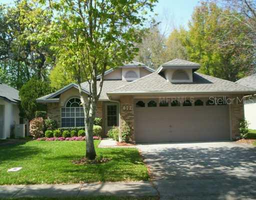 412 MacGregor Road Winter Springs, FL 32708 - Photo 1 of 1 a front view of a house with garden