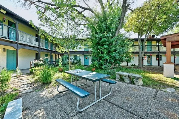 a garden view with a seating space