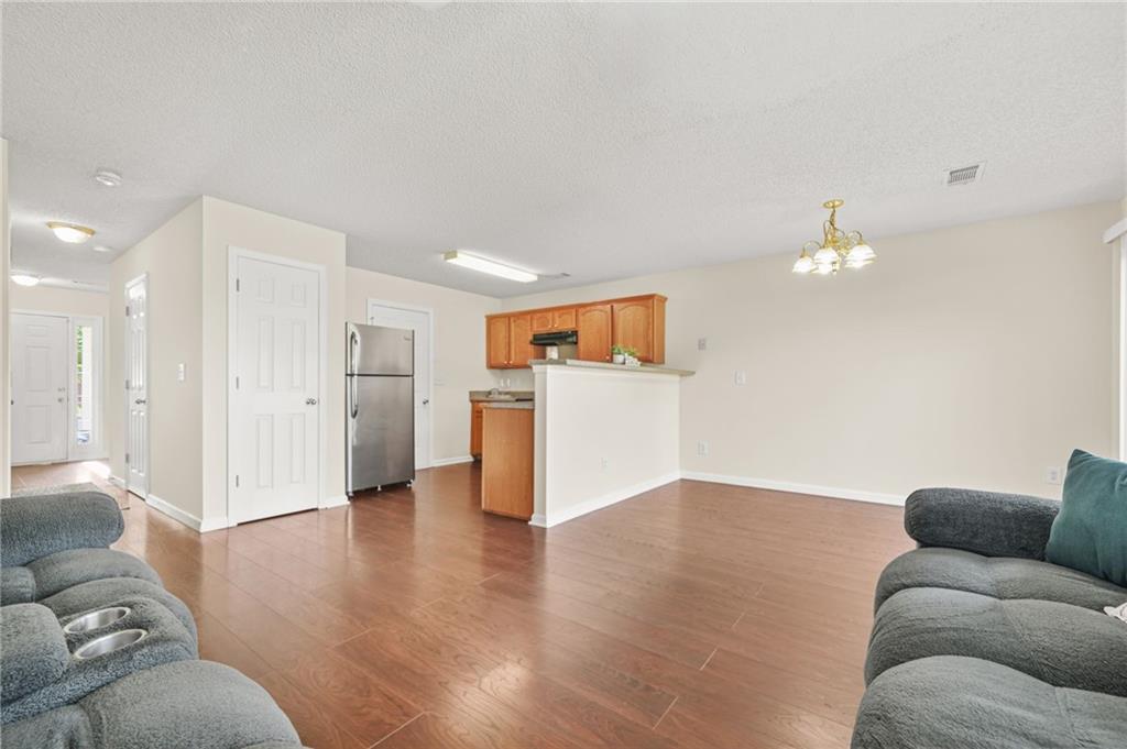 7104 Georges Way Morrow, GA 30260 - Photo 13 of 39 a living room with furniture and kitchen view