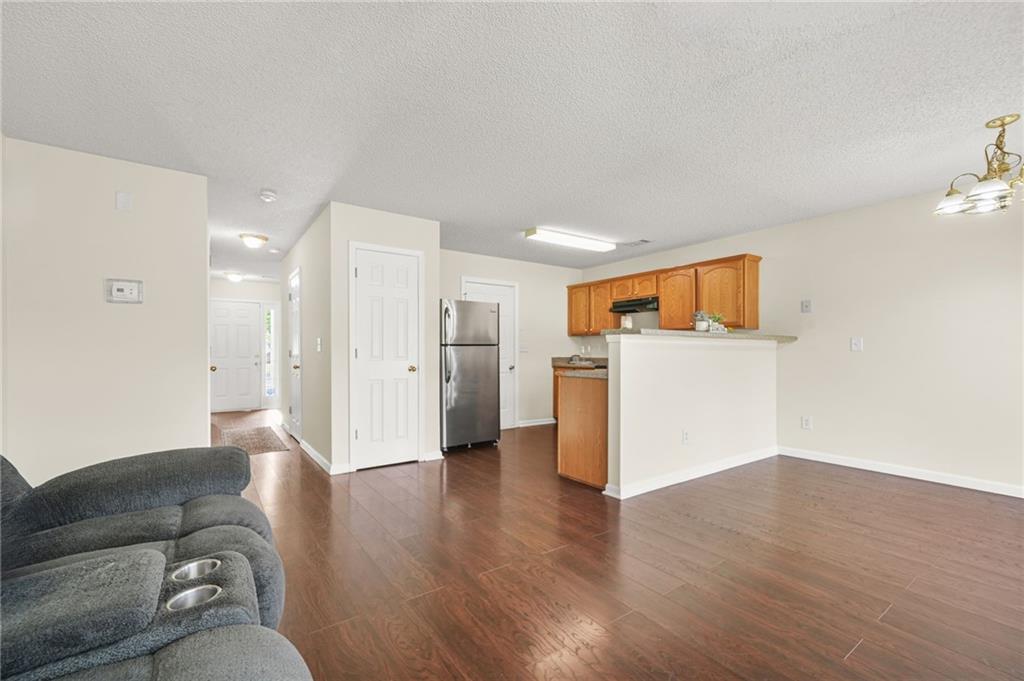 7104 Georges Way Morrow, GA 30260 - Photo 19 of 39 a living room with furniture and kitchen view