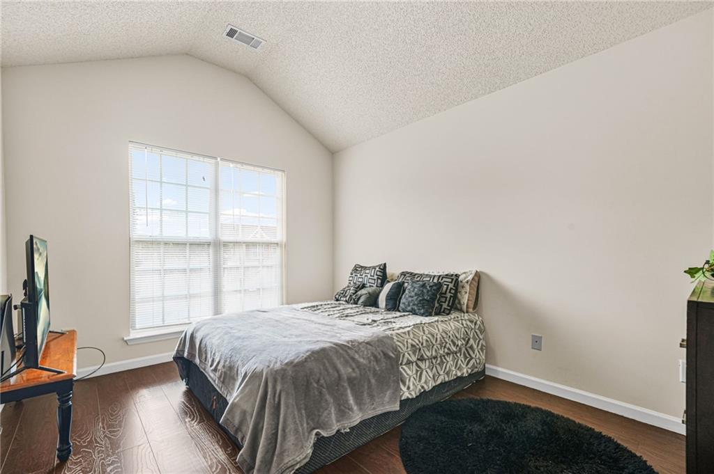 7104 Georges Way Morrow, GA 30260 - Photo 20 of 39 a bedroom with a bed and a window