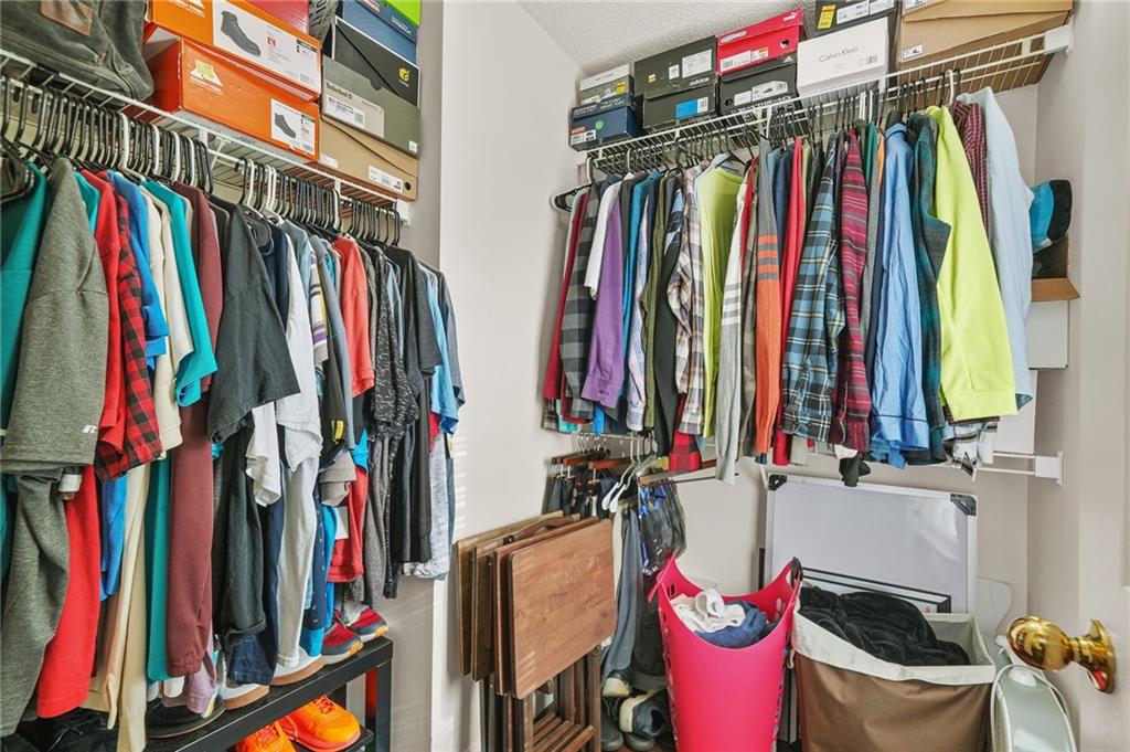 7104 Georges Way Morrow, GA 30260 - Photo 23 of 39 a view of walk in closet with clothes