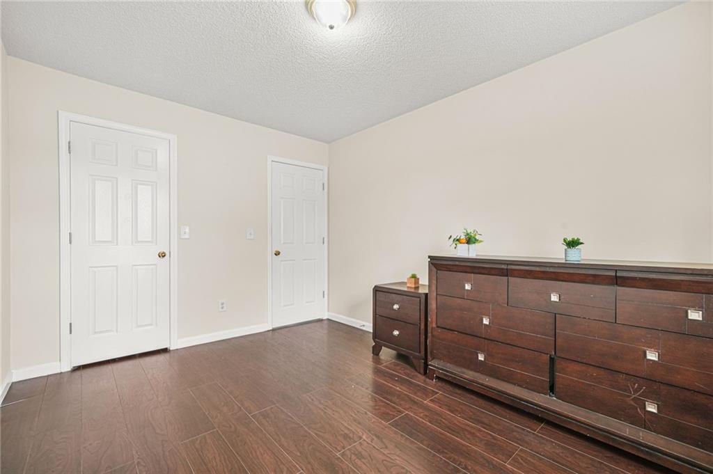 7104 Georges Way Morrow, GA 30260 - Photo 26 of 39 a room with lots of furniture and wooden floor