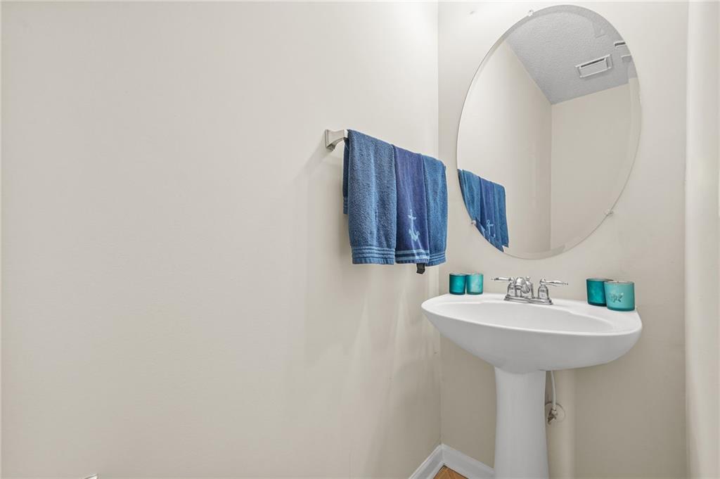 7104 Georges Way Morrow, GA 30260 - Photo 31 of 39 a bathroom with a sink and a mirror
