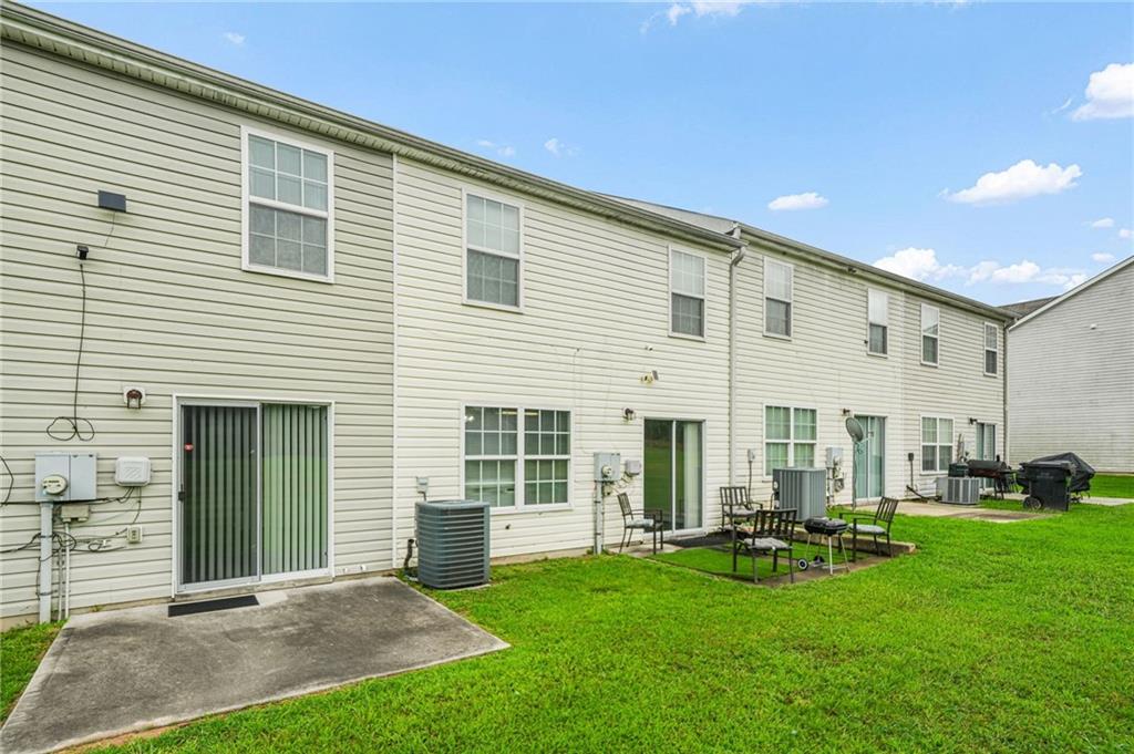 7104 Georges Way Morrow, GA 30260 - Photo 37 of 39 a front view of a house with a yard and sitting area