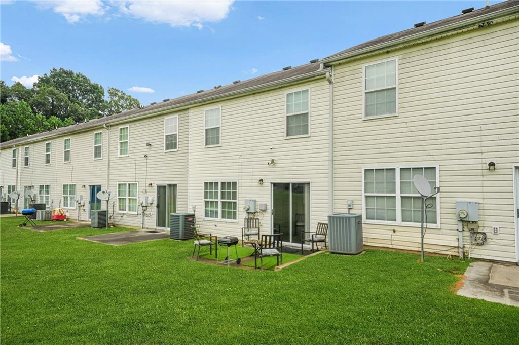 7104 Georges Way Morrow, GA 30260 - Photo 38 of 39 a view of an house with backyard porch and sitting area