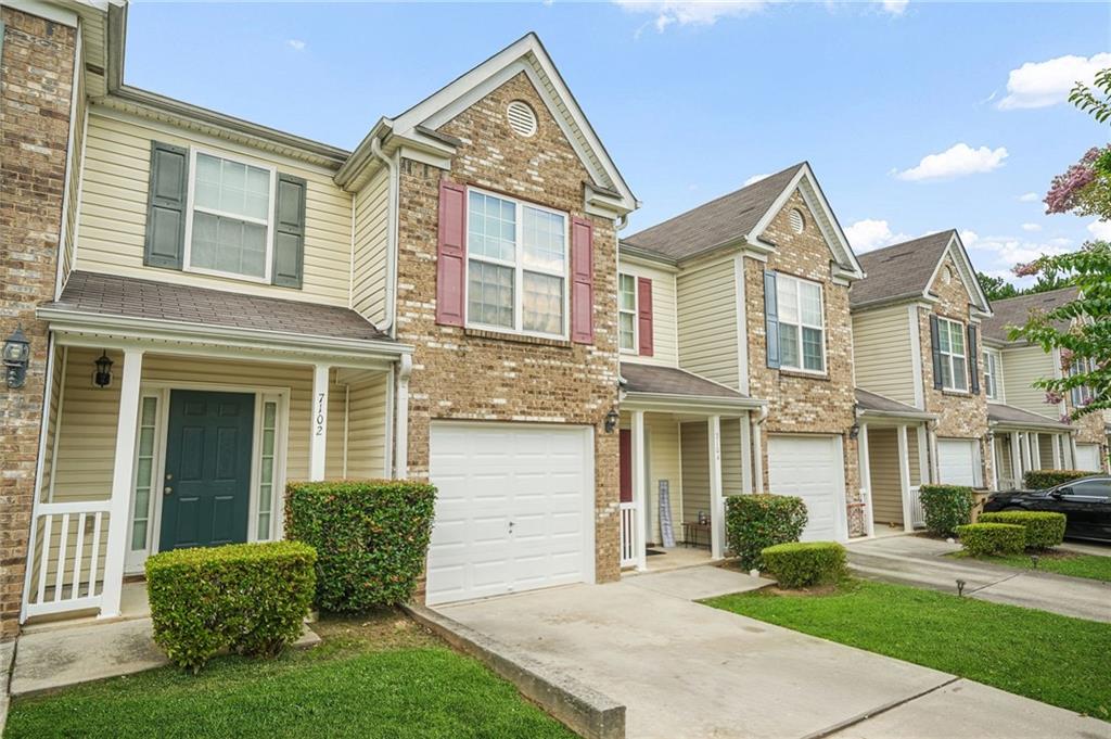 7104 Georges Way Morrow, GA 30260 - Photo 4 of 39 front view of a house with a yard