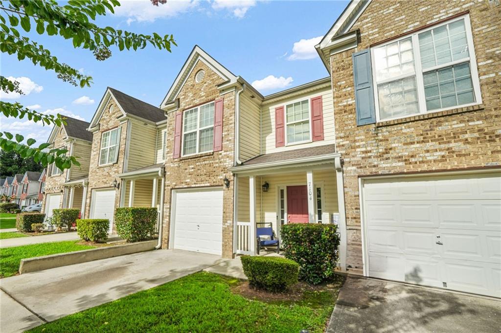 7104 Georges Way Morrow, GA 30260 - Photo 7 of 39 front view of a house with a yard