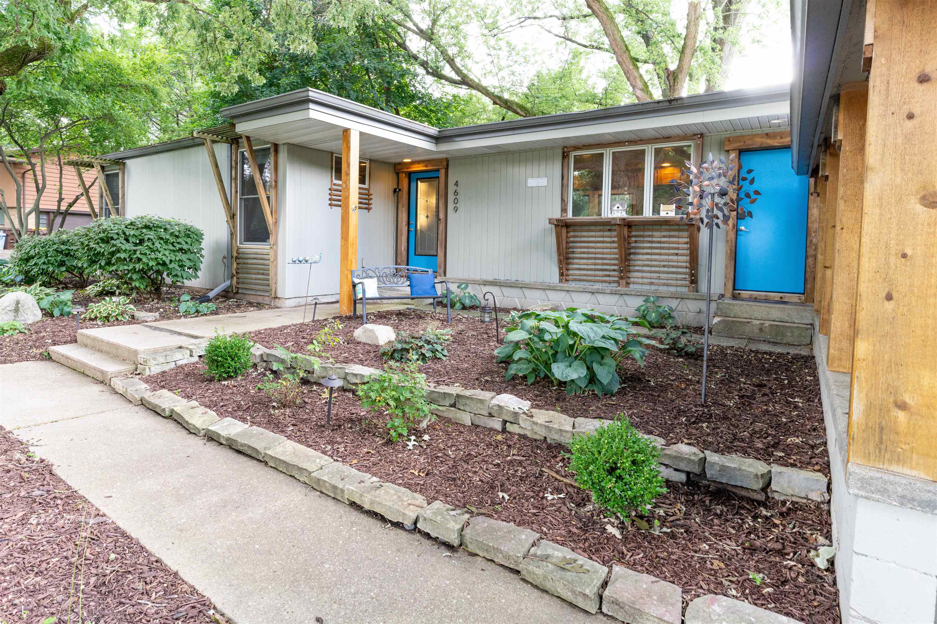 a front view of a house with garden