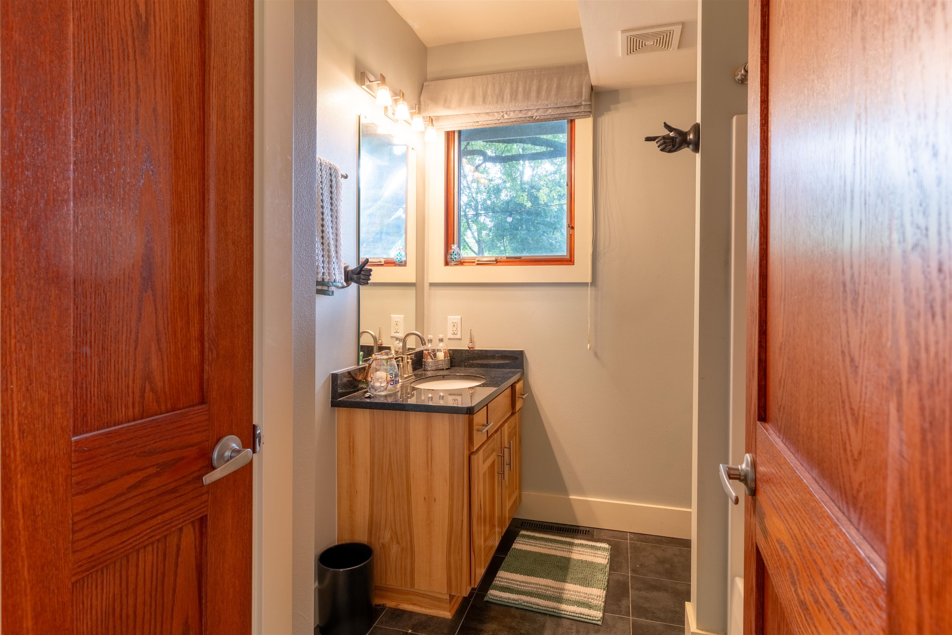 4609 Brookview Road Rockford, IL 61107 - Photo 20 of 44 a bathroom with a sink a mirror and shower