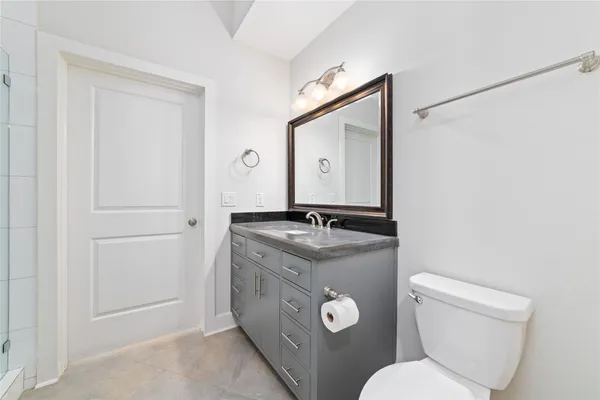 an empty room with a ceiling fan