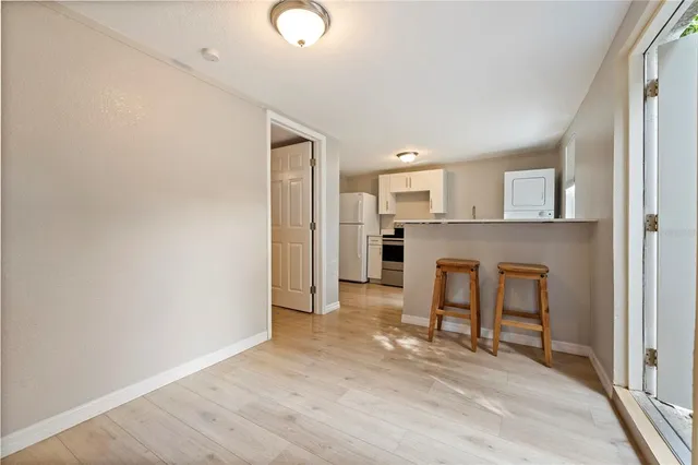 a view of a kitchen with a workspace and a fireplace