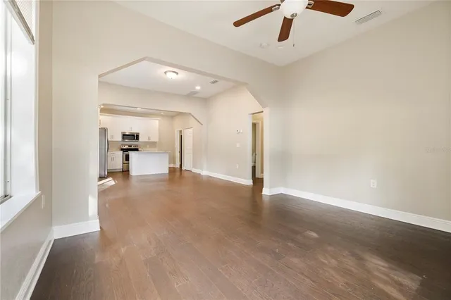 a view of a hall with wooden floor