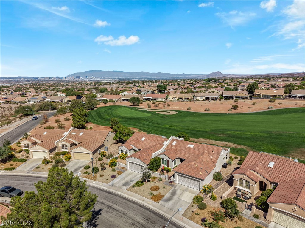 2738 Grand Forks Road Henderson, NV 89052 - Photo 40 of 52 An aerial perspective captures elegant tile-roofed residences bordering a lush green golf course.