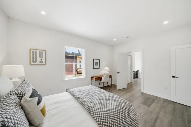 a bedroom with a large bed and a table