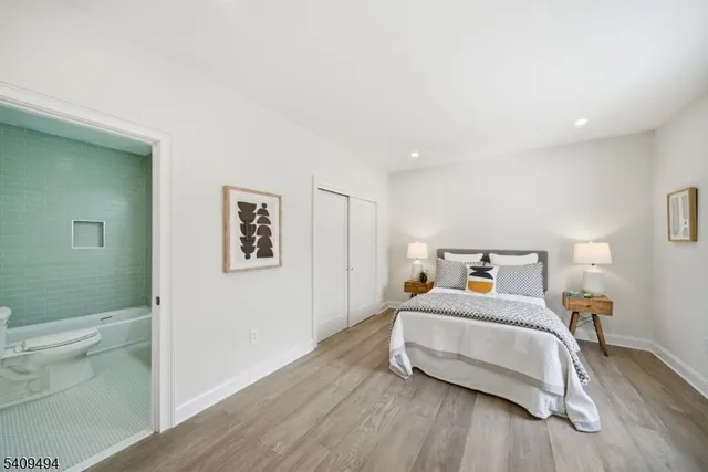 a bedroom with a bed and toilet