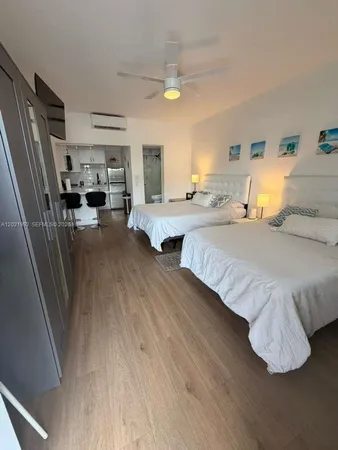 a bedroom with double bed and a window