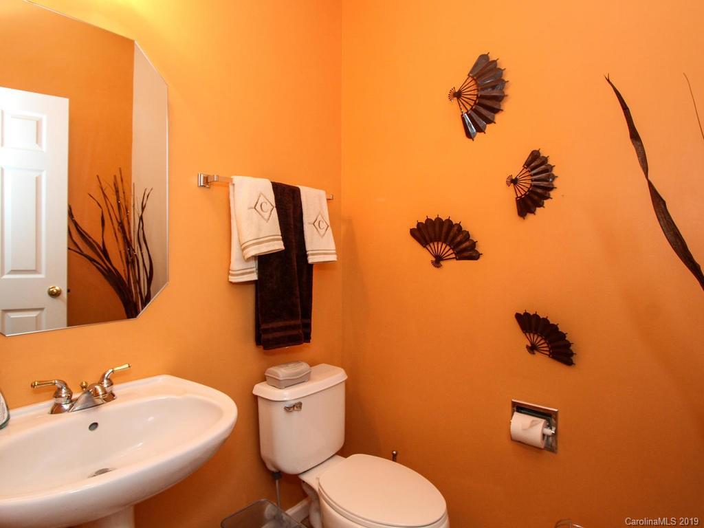 6924 Reedy Creek Road Charlotte, NC 28215 - Photo 11 of 47 a bathroom with a toilet sink and mirror