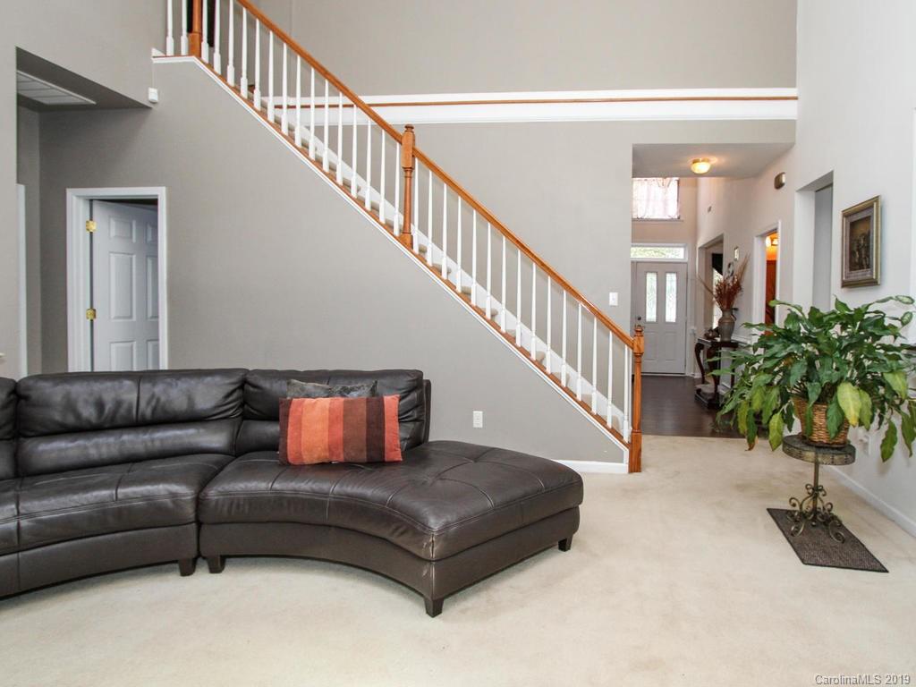 6924 Reedy Creek Road Charlotte, NC 28215 - Photo 13 of 47 a living room with furniture and a potted plant