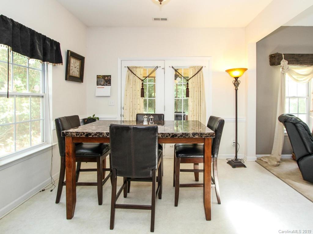 6924 Reedy Creek Road Charlotte, NC 28215 - Photo 17 of 47 a view of a dining room with furniture and a window