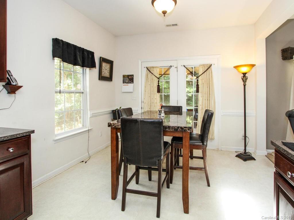 6924 Reedy Creek Road Charlotte, NC 28215 - Photo 20 of 47 a view of a dining room with furniture and a window