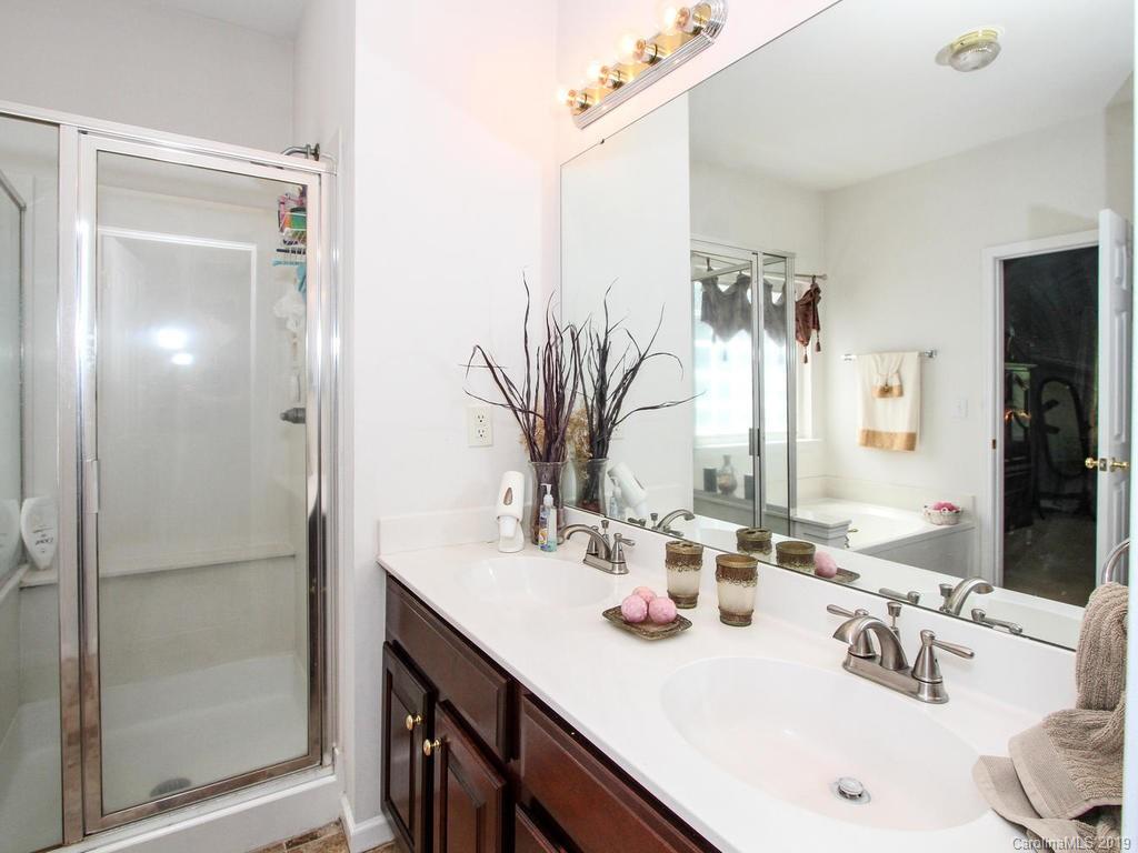 6924 Reedy Creek Road Charlotte, NC 28215 - Photo 26 of 47 a bathroom with a sink and a mirror