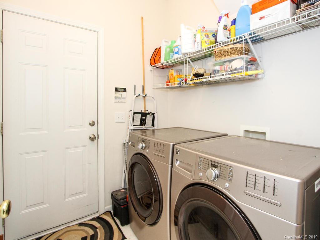 6924 Reedy Creek Road Charlotte, NC 28215 - Photo 28 of 47 a utility room with dryer and washer