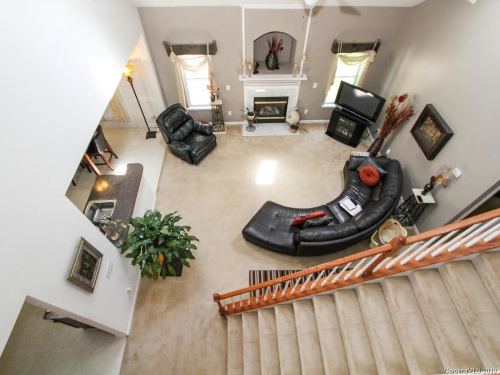 6924 Reedy Creek Road Charlotte, NC 28215 - Photo 29 of 47 a room with furniture and a mirror