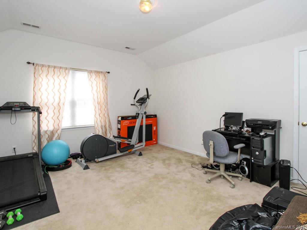 6924 Reedy Creek Road Charlotte, NC 28215 - Photo 30 of 47 a view of a workspace with furniture and a window