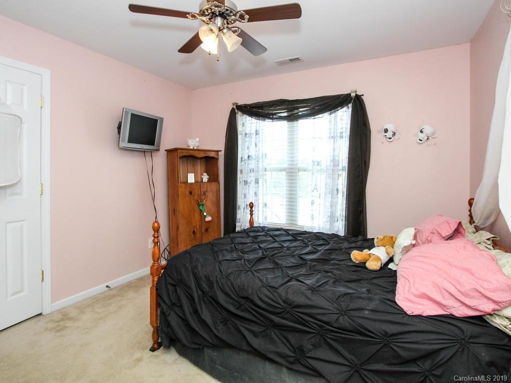 6924 Reedy Creek Road Charlotte, NC 28215 - Photo 33 of 47 a bedroom with a bed and a window