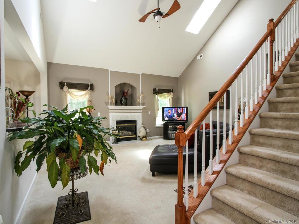 6924 Reedy Creek Road Charlotte, NC 28215 - Photo 5 of 47 a living room with furniture and a potted plant