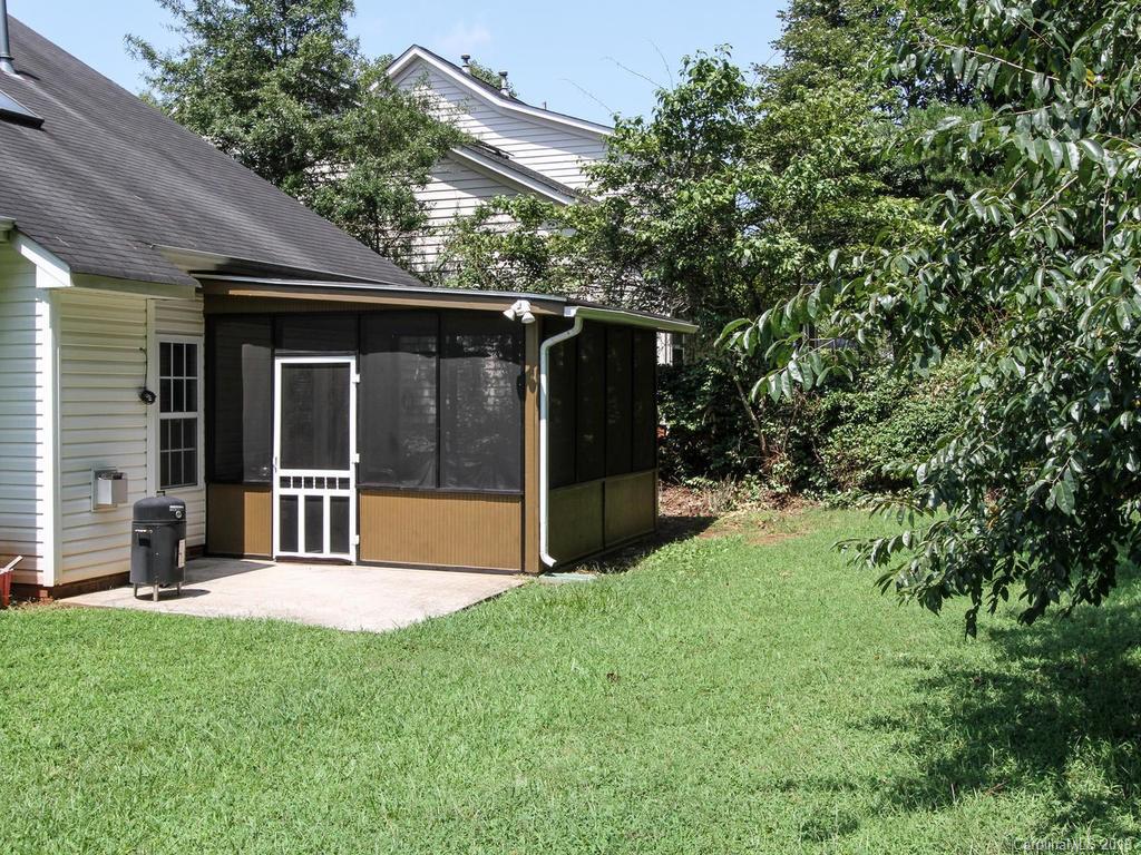 6924 Reedy Creek Road Charlotte, NC 28215 - Photo 43 of 47 a view of house with backyard outdoor seating and green space