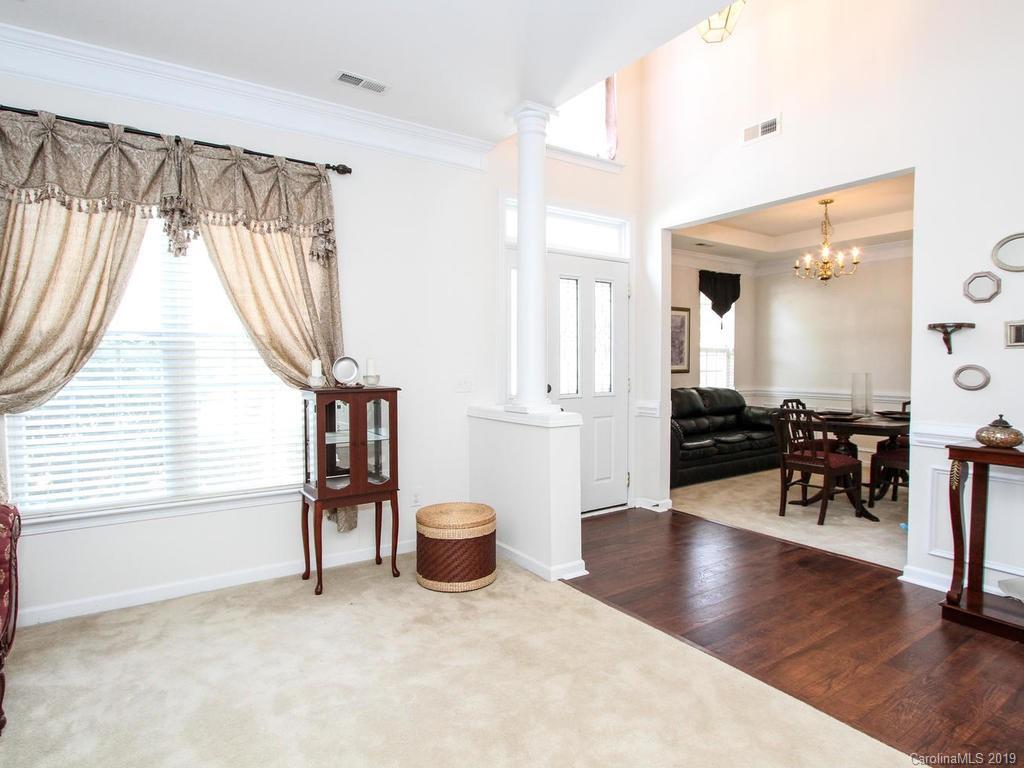 6924 Reedy Creek Road Charlotte, NC 28215 - Photo 10 of 47 a living room with furniture and a wooden floor