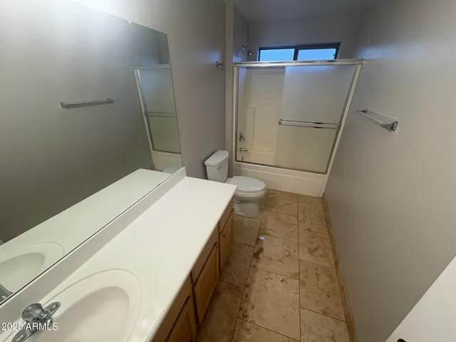 a bathroom with a sink and a shower