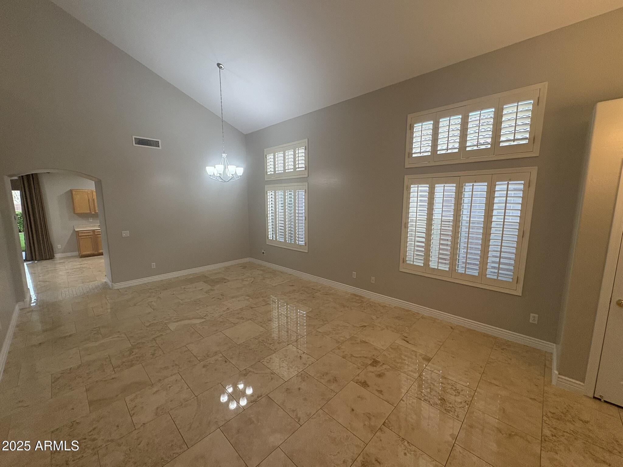 17633 North 41st Street Phoenix, AZ 85032 - Photo 3 of 24 a view of an empty room with a window