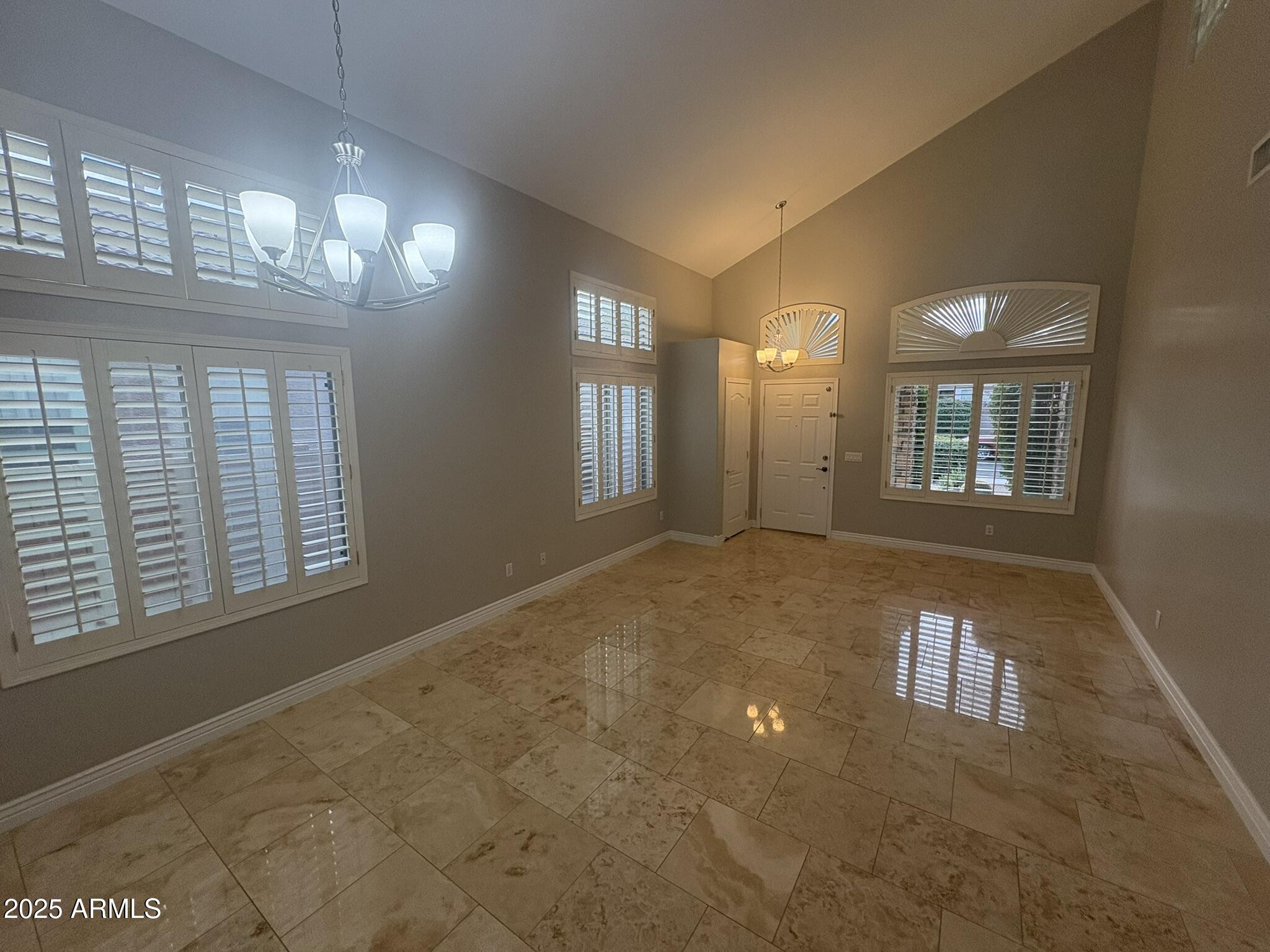 17633 North 41st Street Phoenix, AZ 85032 - Photo 4 of 24 a view of an empty room with a fireplace and a window