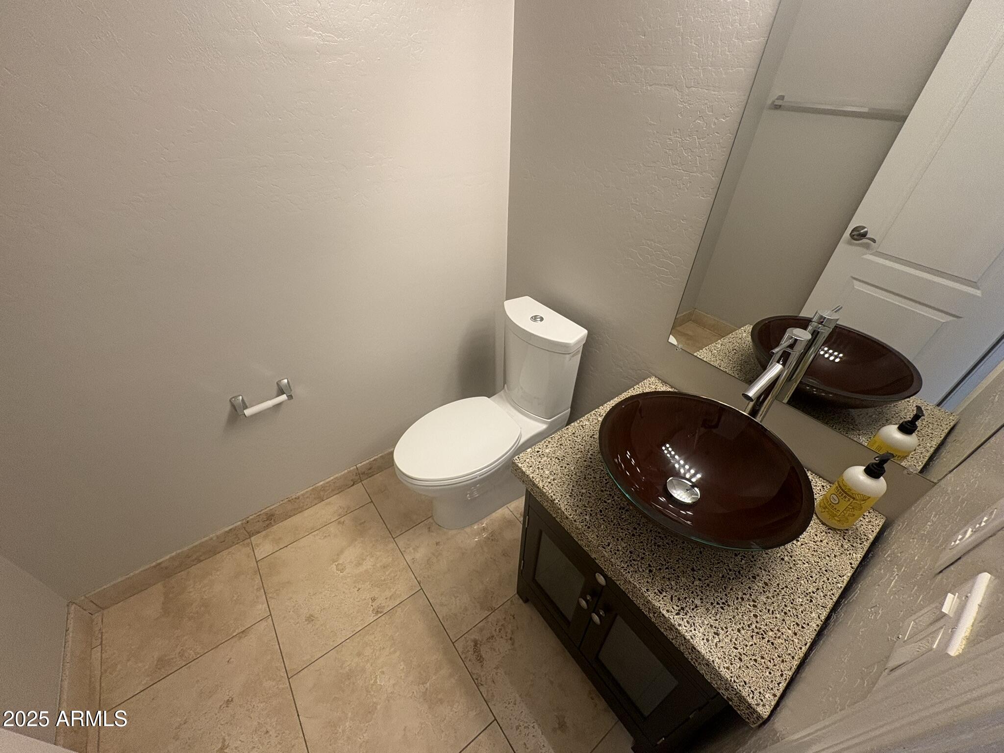 17633 North 41st Street Phoenix, AZ 85032 - Photo 10 of 24 a bathroom with a toilet and a sink