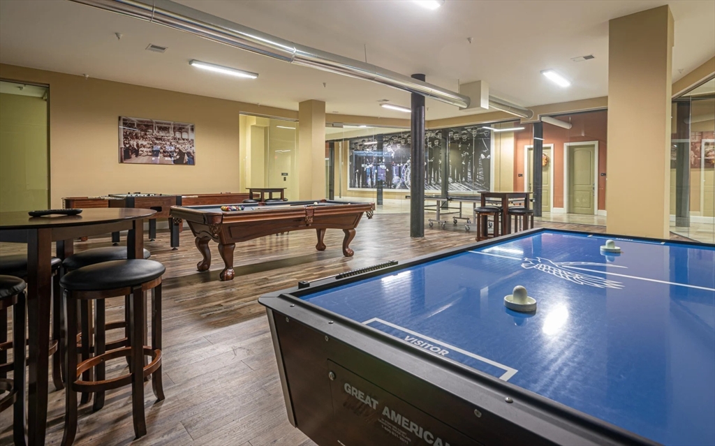 300 Canal Street, Unit 5101 Lawrence, MA 01840 - Photo 17 of 19 a living room with furniture pool table and a large window