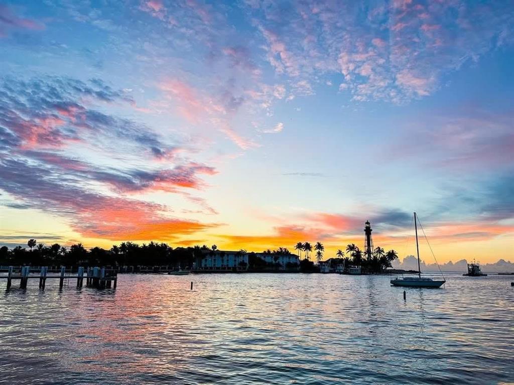 a view of a lake and sunset